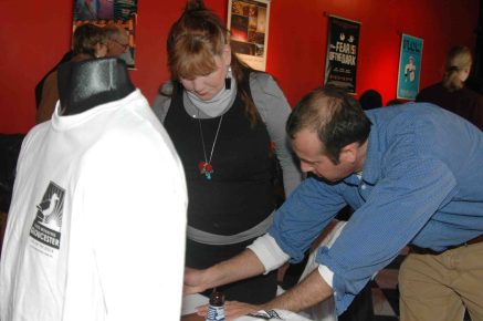 Barbara Koen and Joey get the t-shirts ready