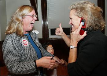 Mayoral candidate Carolyn Kirk gets the thumbs-up from her sister-in-law, Jennifer Kirk, at City Hall after the results for the preliminary election came in Tuesday night. Jim Destino and Carolyn Kirk won the two spots to run for mayor. Photo by Mary Muckenhoupt/Gloucester Daily Times, Tuesday, Oct. 2, 2007
