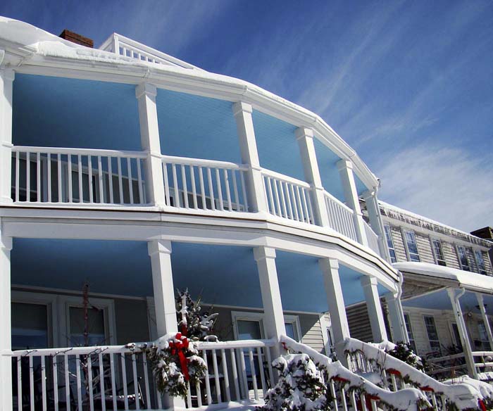 porches on home in Annisquam with porch ceilings painted sky blue