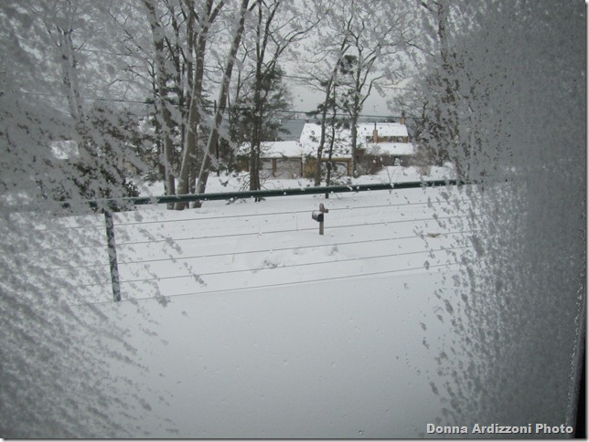 Snow on my windows looking across the street