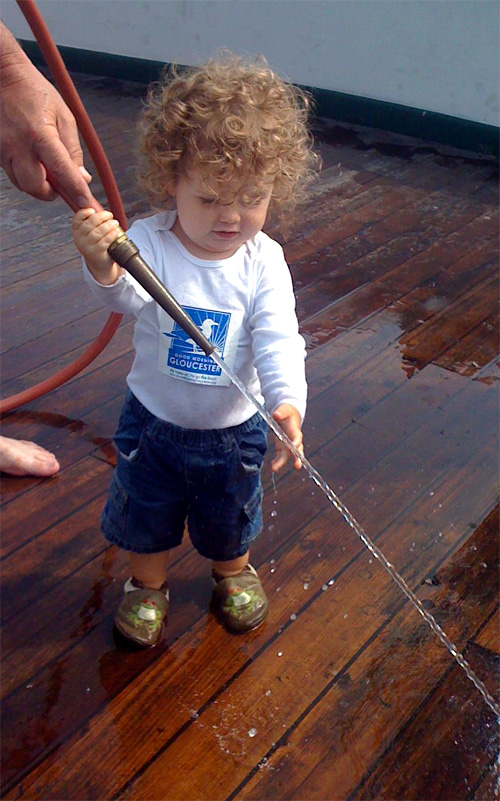 Caton Andrade swabbing Schooner Adventure decks in GMG T