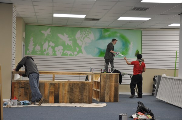 Working on Eco Boutique mural