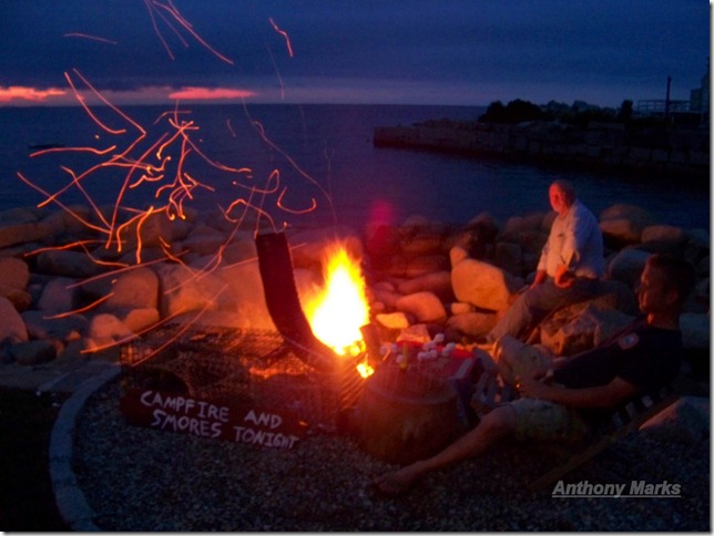 Bill and David tend the campfire at the Lobster Pool restaurant.