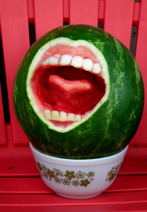 man eating watermelon