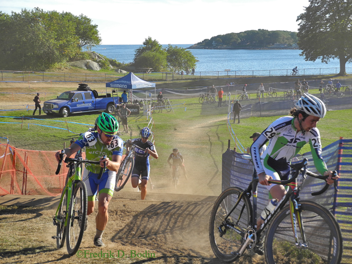 This "Cross" is dusty and  great event.  Our harbor is in the background. Part of the course is to dismount and run your bikes up four or five steps, and then mount up and speed on. What fun!