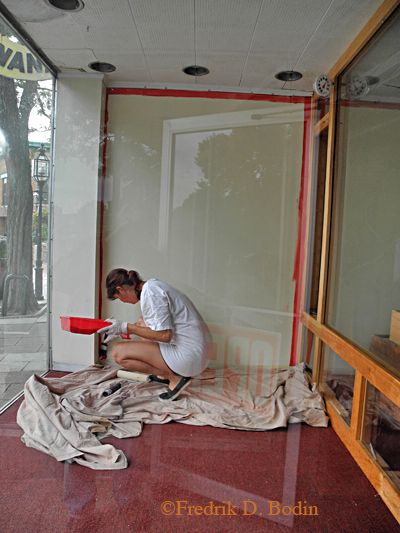 Peggy Russell, friend and owner of the POP Gallery, gets started on my starboard window.