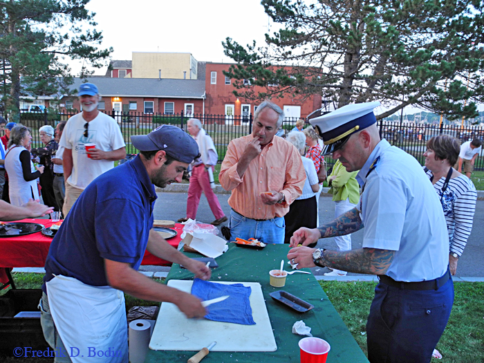 USCG Station Gloucester Commander Robert Lepare samples the oysters.