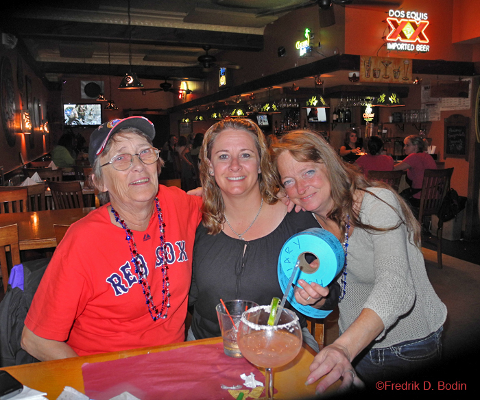 Yesterday, while walking down Main Street to see what the police activity was, I saw Barbara, a woman who worked for many years at Bookends, where Dogtown Books is now. She was hurrying to the same emergency scene, because her daughter works nearby. She invited me to the AmVets fundraiser next door at Jalapenos that night. Once there, I saw Barbara's mother, Donna Hand, who was a bartender at "The Rigger" for many years before Jalapenos, which was next door to my gallery. Also volunteering was City Councilor Melissa Cox, who's running for office again and is everywhere as a volunteer. L–R: Donna Hand, Melissa Cox, and Barbara, all there for the AmVets 32 Auxiliary. Donna's son and Barbara's brother, is a Black Hawk helicopter pilot. God Bless and we can't tell you where he is, because even we don't know.