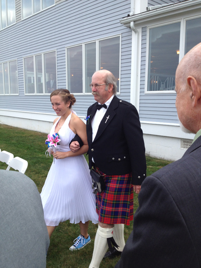 Rhettt Heberling, of Detroit, walks out his daughter in his MacPhereson tartan.
