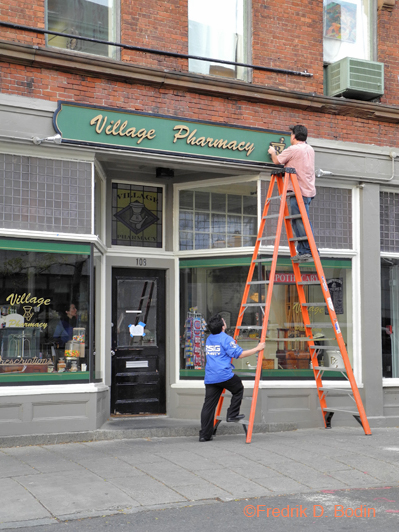 An HBO contractor on the Olive Kitteridge mini-series lays the Rx letters on the mortar and pestle. I'll bet they'll be doing a few more adjustments tomorrow, Sunday. Filming is scheduled for Monday, Tuesday, and Wednesday. 