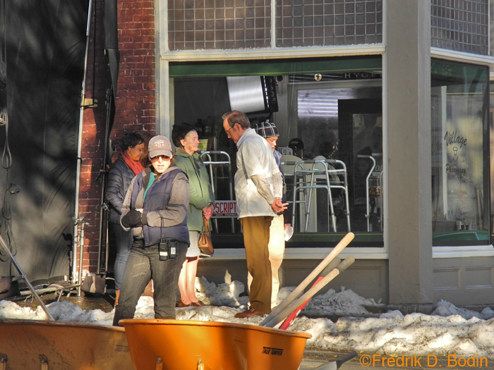 Today was the last day of filming Olive Kitteridge on Main Street. I don't want to be redundant with the snow and production shots. Here are cast members taking a break outside the pharmacy, including the pharmacist. The wheelbarrows and shovels are for moving the snow.
