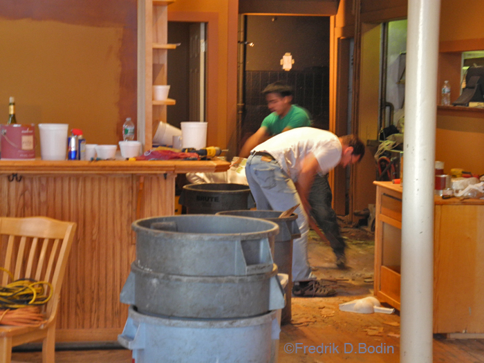 Here, owner and chef Eric Lorden, in the white t-shirt,  is pulling up 100+ years of flooring with a claw hammer. Eric and his construction crew are going petal to the metal, and hoping to open in a couple of weeks.
