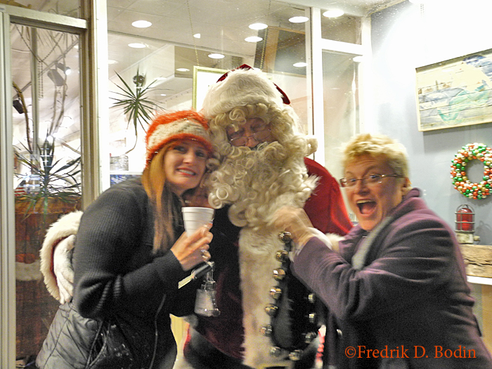It was the traditional Ladies' Night, and they sure came out. Santa even stopped in, and here he is with up and coming painter Laureen Maher and Janet Crary. They'll both be at the preview opening party at the Magnolia Historical tomorrow: https://goodmorninggloucester.com/wp-content/uploads/2013/11/magnolia-historical-society-art-show-poster31.jpg 