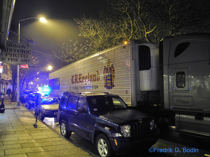 There is a huge 53 foot truck plus to 20 foot cab stuck outside on Main Street in front of my gallery. Bashful Fred went out and asked if they'd like Gloucester Police assistance to clear the parked cars (not all legally parked). I called and the officer said they'd send someone down. I've done this a hundred times. I wish I had a care package to give to truck drivers who get trapped in this pre-1700 curve. The truck is still there at 8:33pm. Two cruisers with lights flashing. This is a difficult one. Just don't hit my car and good journey. Oh yeah, that's my blue Jeep center foreground. I really don't want to sleep here. A young girl just came in to ask if I owned a gray Toyota Prius, related to the truck dilemma. I couldn't figure out where she was coming from, so I just thanked her for trying to help. 