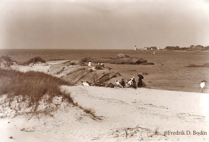 Here's Wingaersheek Beach, with 'Squam Point and Annisquam Light in the distance. Although the fashionable beach goers are fully clothed, this may be a hot day in the summer.