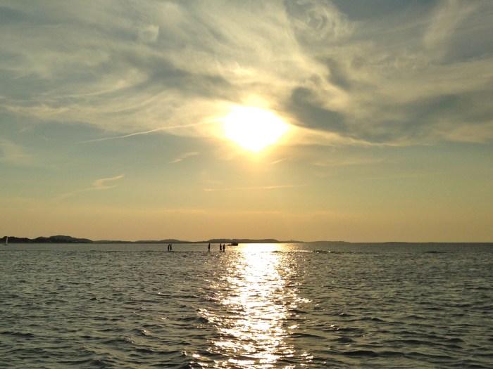 Sun sets on Fiesta and Mother Nature looks over those on the sandbar at Wingaersheek Beach