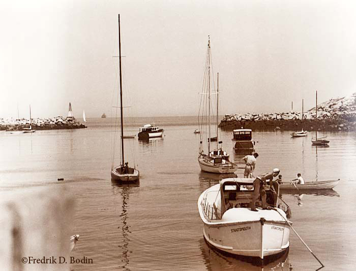 US Coast Guard sailors swab the decks on their launch Straightsmouth. The launch was most likely the transport to Straightsmouth Island Light. The 37 foot lighthouse marks the course to Rockport Harbor with its green flashing light. The island is now owned by the Massachusetts Audubon Society.