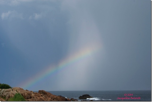 storm cloud and rainbow