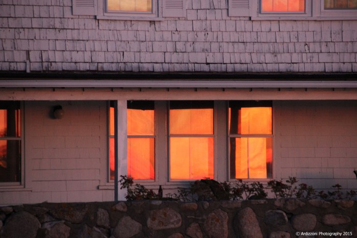 november 21, 2015 sun reflecting on windows of the house on the water