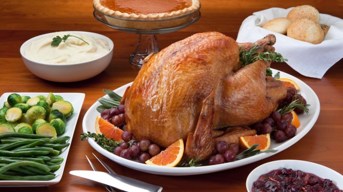 Roast Turkey and Side Dish's on a Cherry Wood Table.
