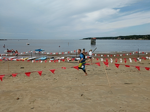 After grueling paddle board race footrace with paddle to finish line