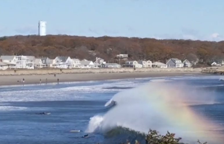 surfing through rainbows wave spray