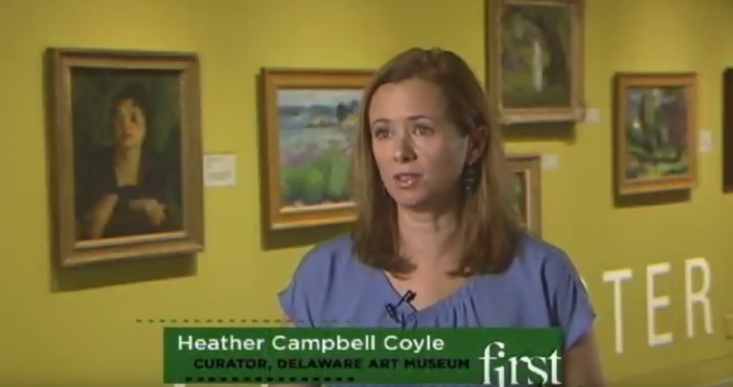 Curator Coyle interviewed Delaware Art Museum in front of Gloucester wall of John Sloan retrospective