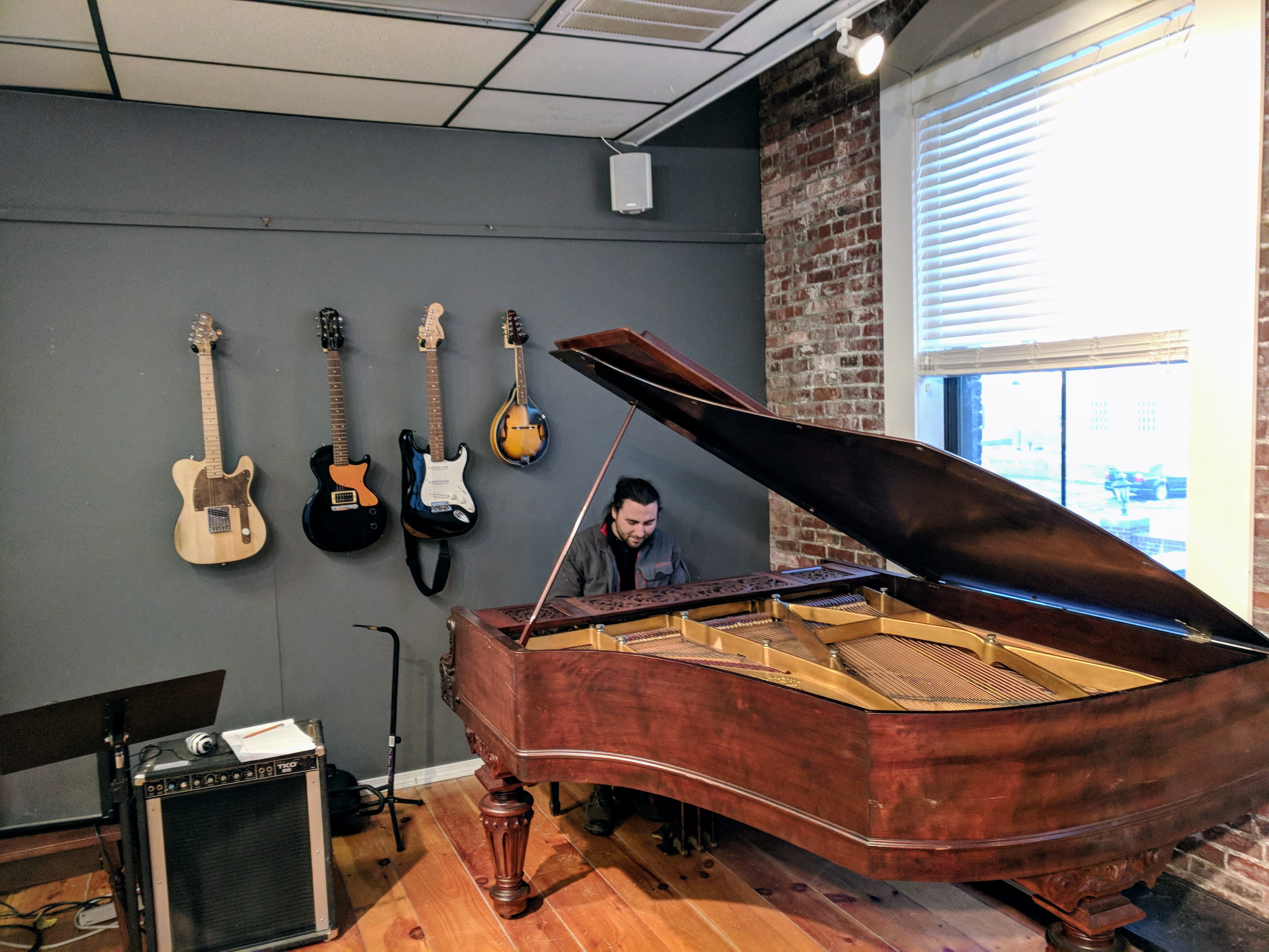 Zach Gorrell at Sound Harbor demonstrating new baby grand donated by Mac Bell ©c ryan Jan 2018_161254.jpg