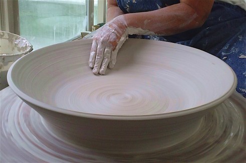 Curtis - Wheel throwing large platter.jpg