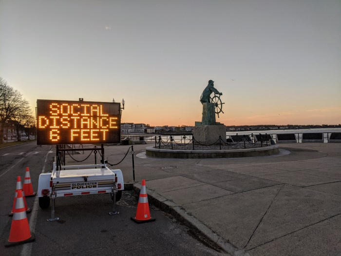 SOCIAL DISTANCE_Man at Wheel memorial_Signs of the times_Gloucester Mass., 6 May 2020, covid-19 © c ryan (1)