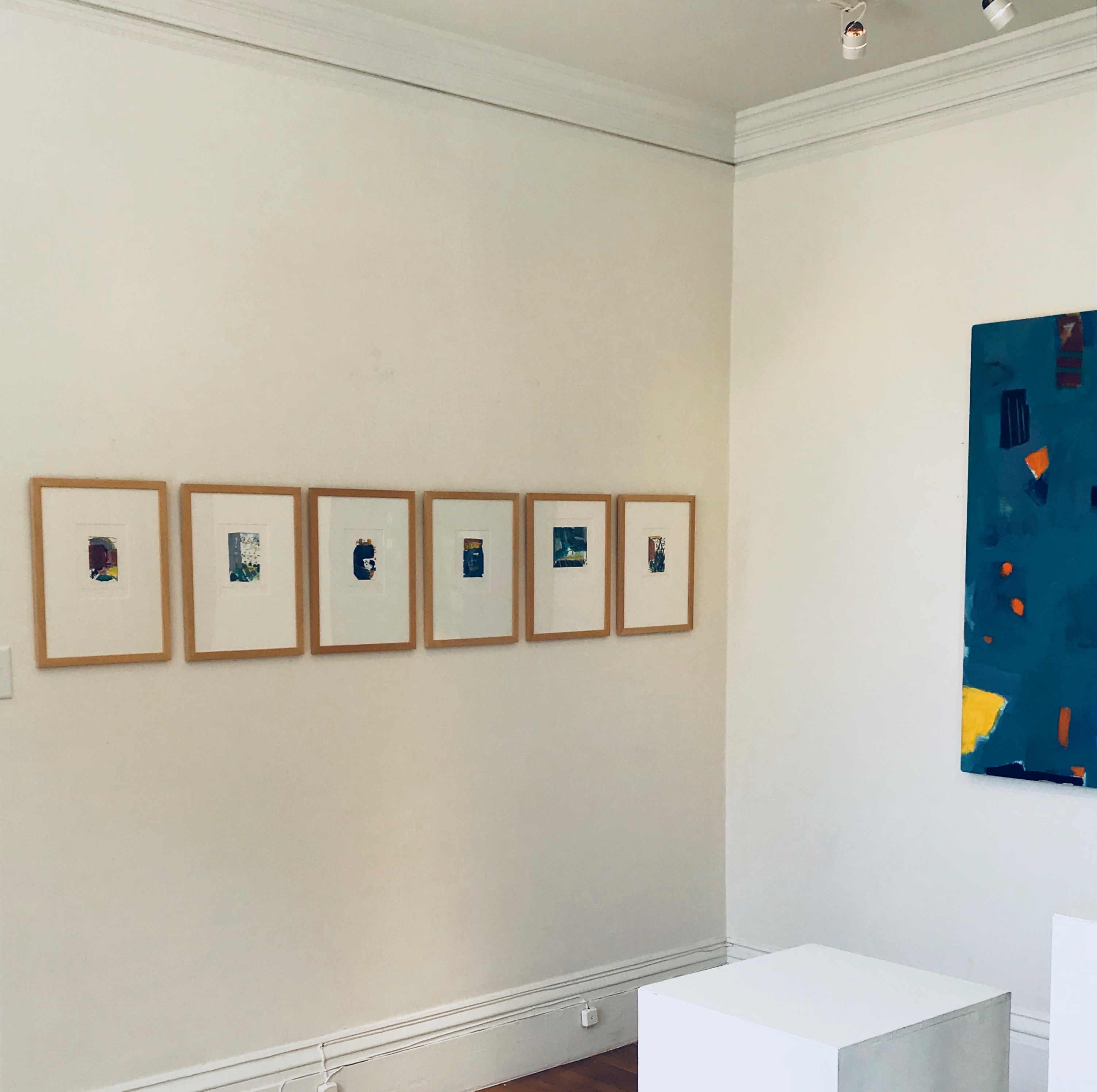 Six framed works . Untitled (Blue) on adjacent wall